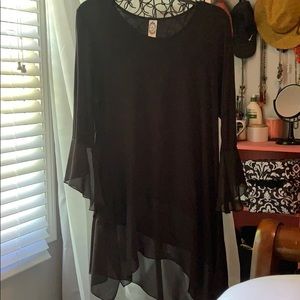 Black asymmetrical top with sheer detailing